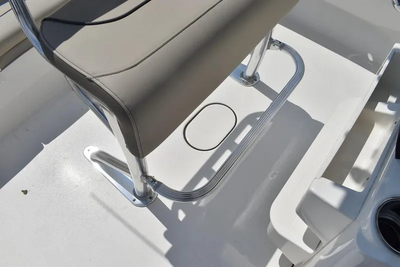 Slide: The Image of 2024 Key West 189 FS boat interior with cushioned seating and stainless steel frame. - 24