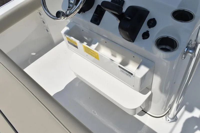 Slide: The Image of 2024 Key West 189 FS boat console with steering wheel and controls. - 25