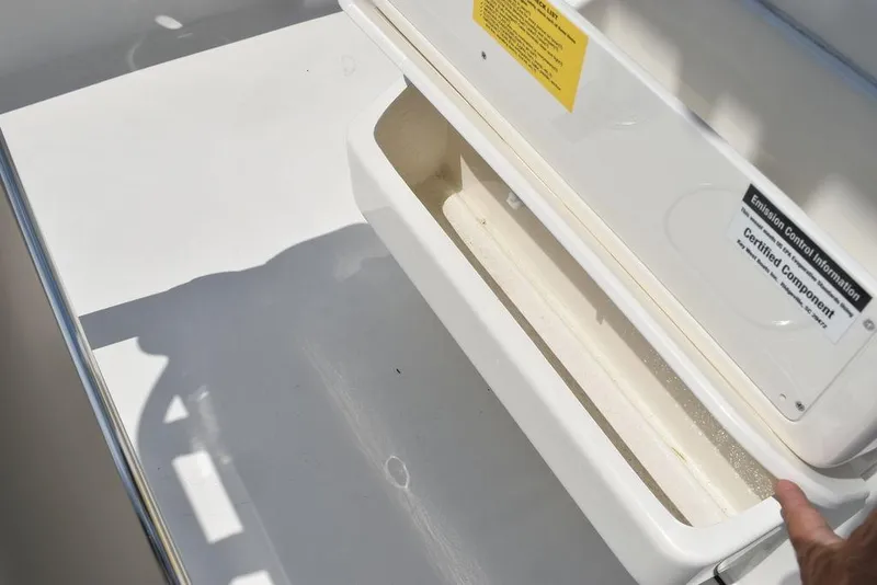 Slide: The Image of 2024 Key West 189 FS boat storage compartment open, showcasing interior space. - 26