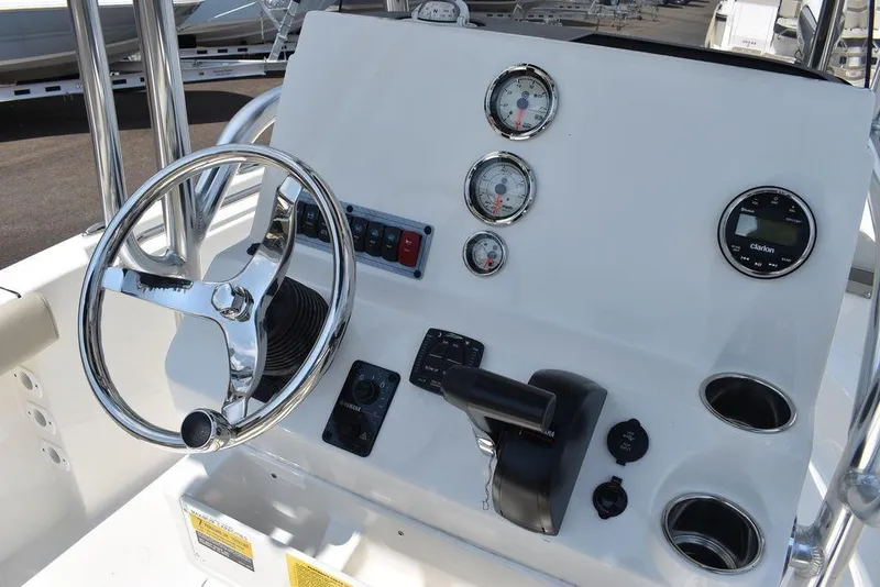 Slide: The Image of 2024 Key West 189 FS boat dashboard with steering wheel and gauges. - 27