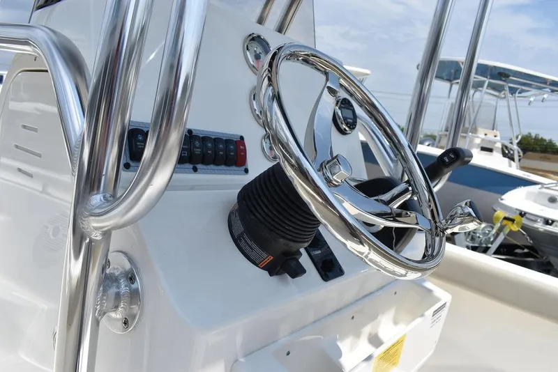 Slide: The Image of 2024 Key West 189 FS boat steering console with chrome details. - 28