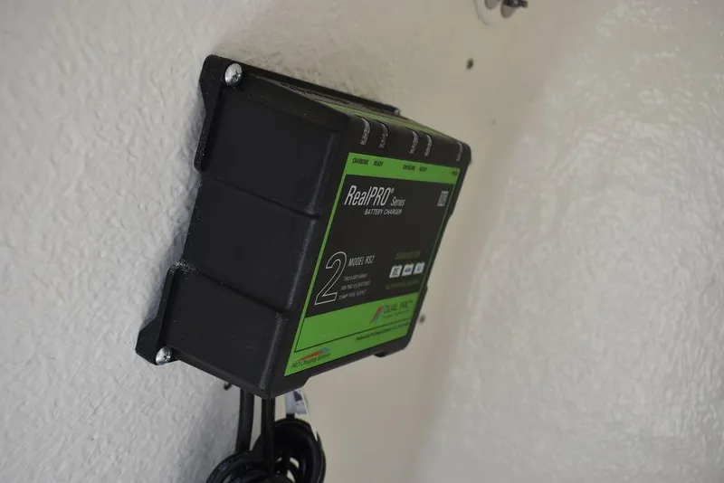 Slide: The Image of Battery charger mounted on 2024 Key West 189 FS boat interior. - 31