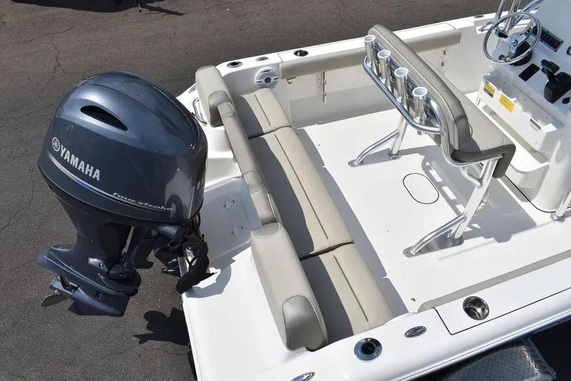 Slide: The Image of 2024 Key West 189 FS boat with Yamaha outboard motor, featuring spacious seating and rod holders. - 7
