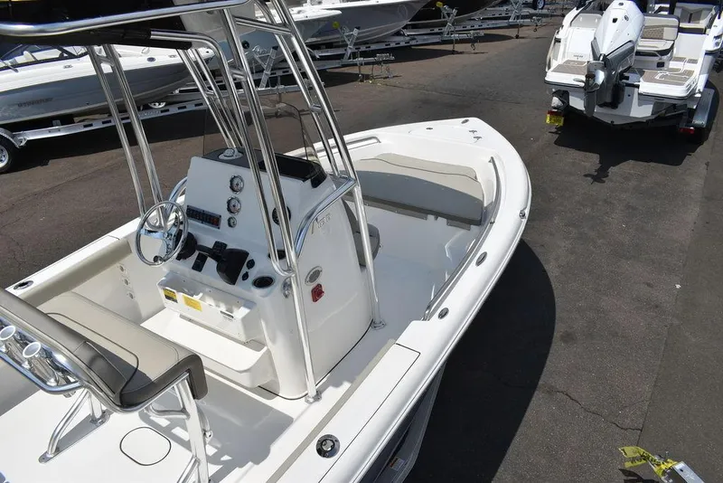 Slide: The Image of 2024 Key West 189 FS boat with center console and seating, displayed outdoors. - 9