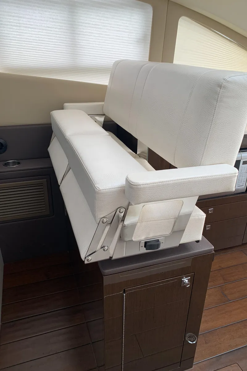 Slide: The Image of Interior seating of a 2020 Carver C37 Coupe yacht with white upholstery. - 31