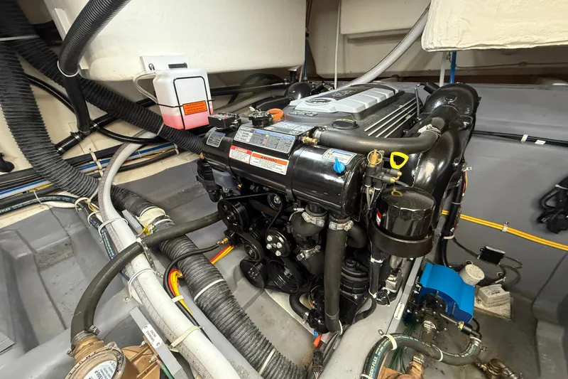 Slide: The Image of Engine room of a 2020 Carver C37 Coupe, showcasing detailed mechanical components. - 54