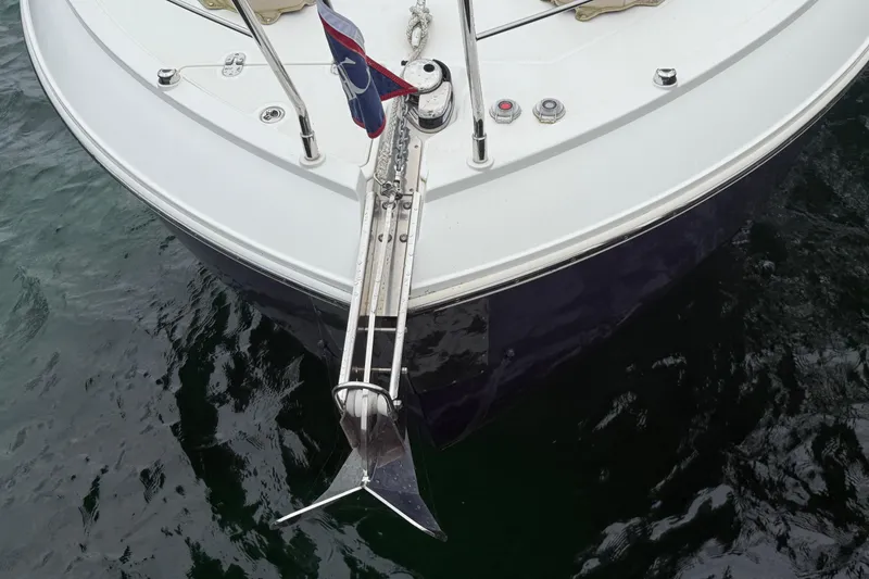 Slide: The Image of Bow of 2020 Carver C37 Coupe yacht with anchor, floating on water. - 6