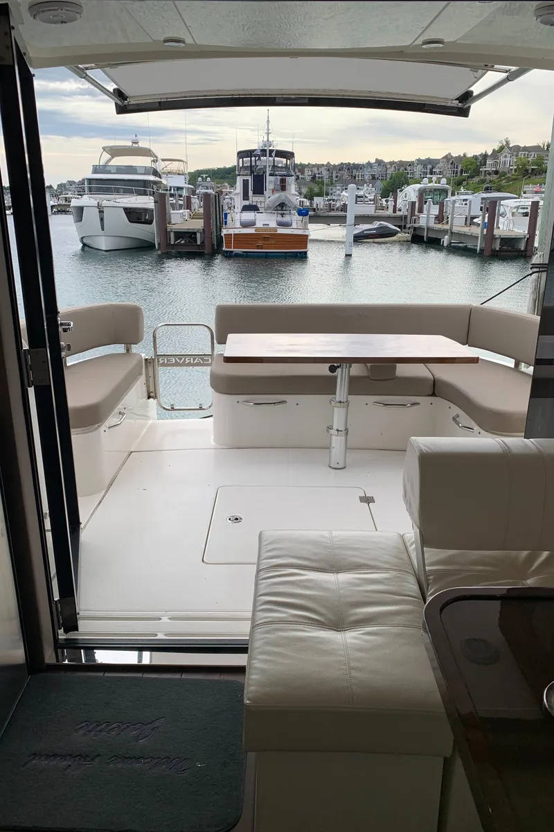 Slide: The Image of 2020 Carver C37 Coupe yacht interior with marina view. - 19