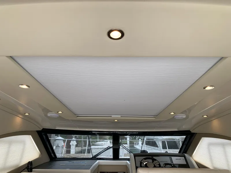 Slide: The Image of Interior view of 2020 Carver C37 Coupe yacht with sunroof and modern dashboard. - 24
