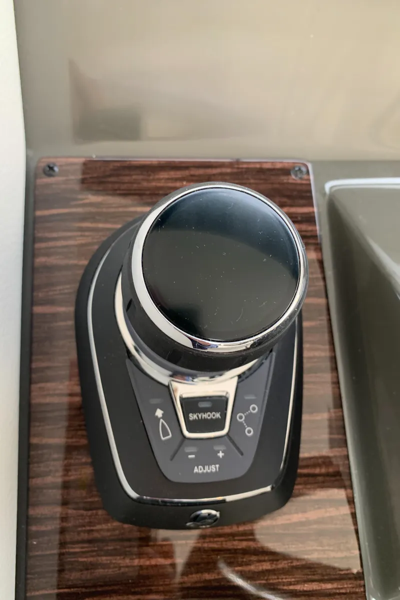 Slide: The Image of 2020 Carver C37 Coupe joystick control on wood panel. - 28