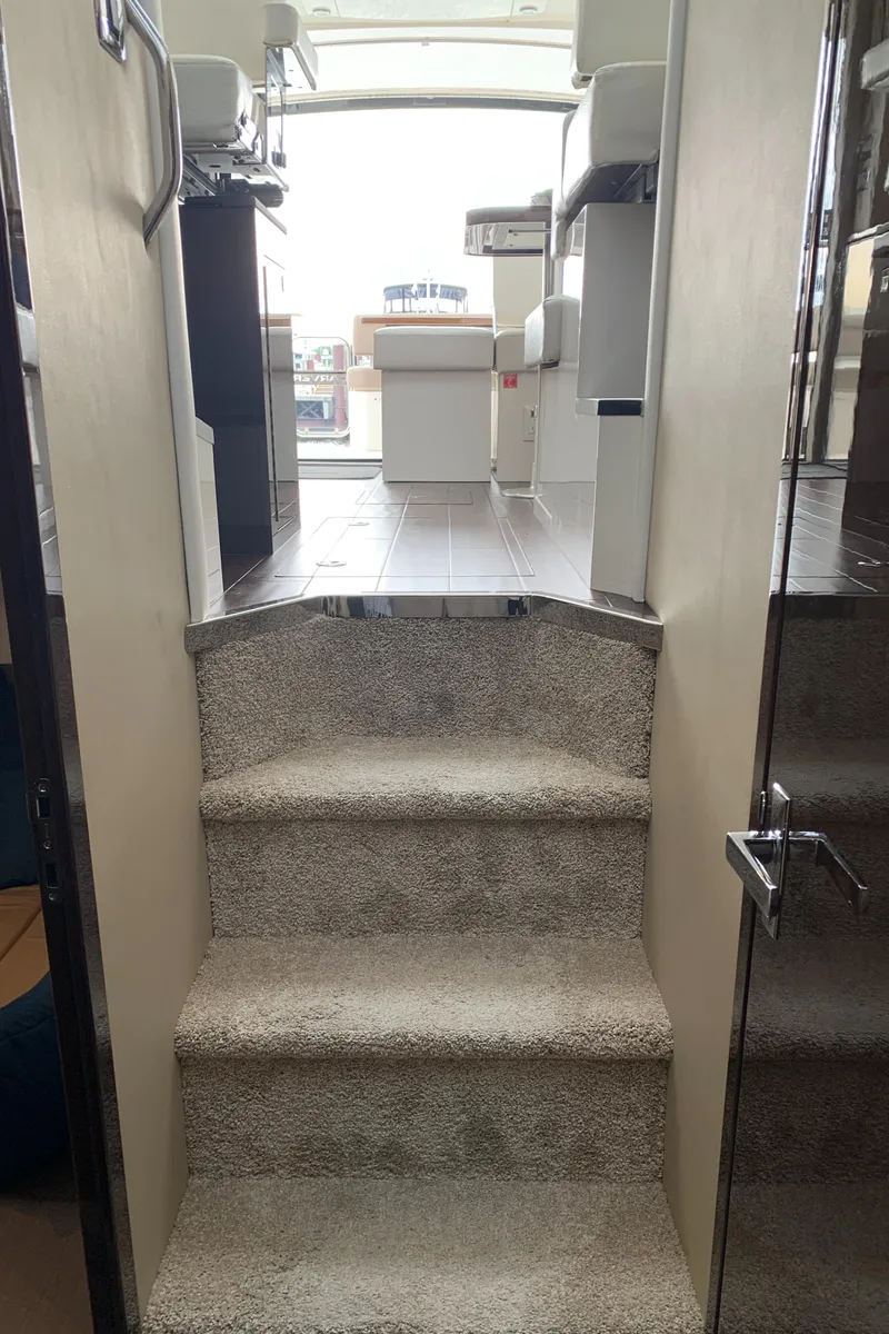 Slide: The Image of Staircase leading to the interior of a 2020 Carver C37 Coupe yacht. - 33