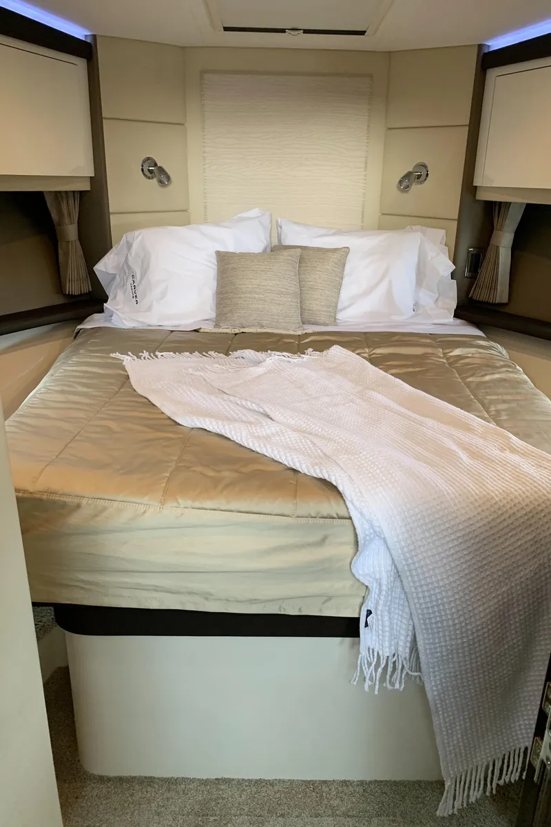 Slide: The Image of Luxurious bedroom in 2020 Carver C37 Coupe yacht with cozy bedding. - 35