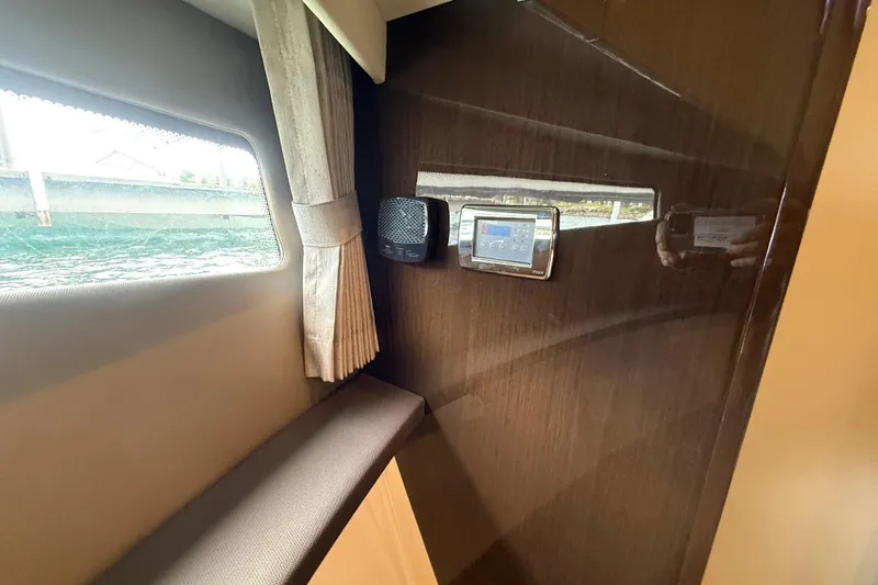 Slide: The Image of Interior of 2020 Carver C37 Coupe with window, speaker, and control panel. - 39