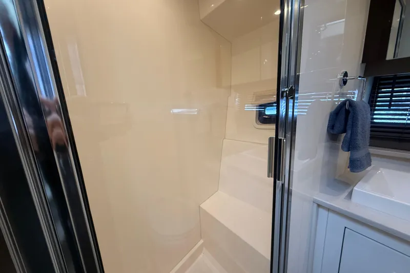 Slide: The Image of 2020 Carver C37 Coupe bathroom with glass shower and modern fixtures. - 42