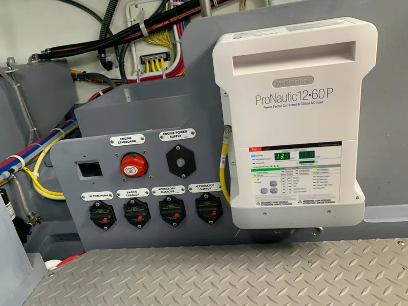 Slide: The Image of Electrical panel and ProNautic12-60P charger in a 2020 Carver C37 Coupe boat. - 45