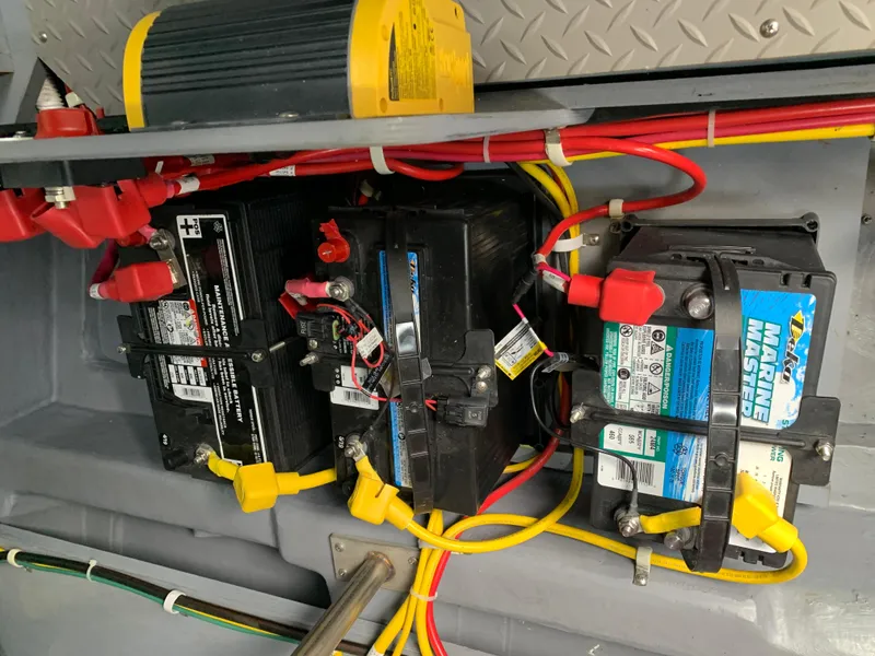 Slide: The Image of 2020 Carver C37 Coupe battery compartment with wiring and components. - 47