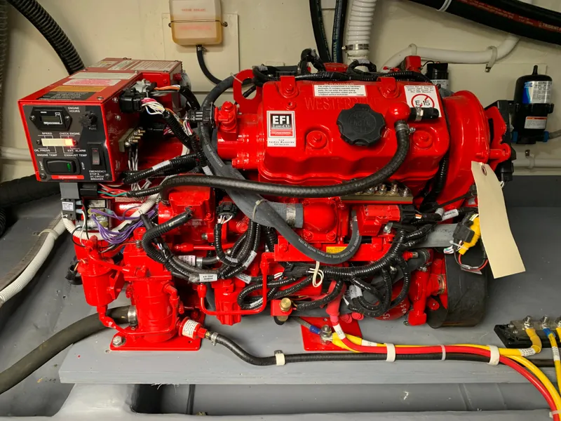 Slide: The Image of 2020 Carver C37 Coupe engine compartment with red EFI engine. - 48