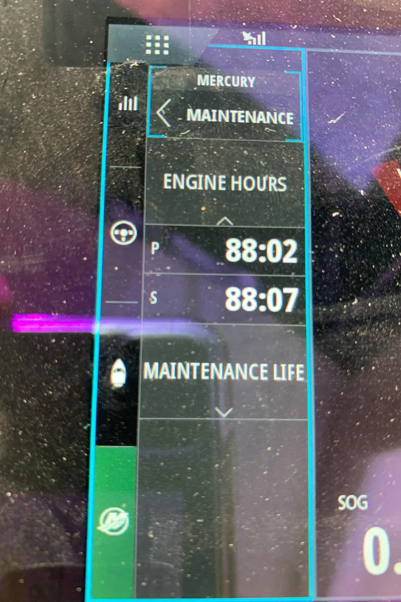 Slide: The Image of 2020 Carver C37 Coupe maintenance screen showing engine hours. - 49