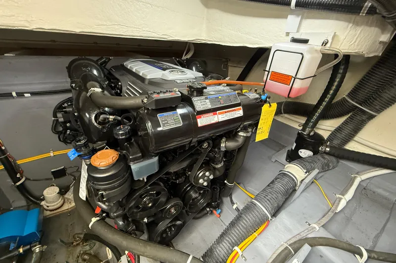 Slide: The Image of Engine compartment of a 2020 Carver C37 Coupe, showcasing detailed mechanical components. - 53