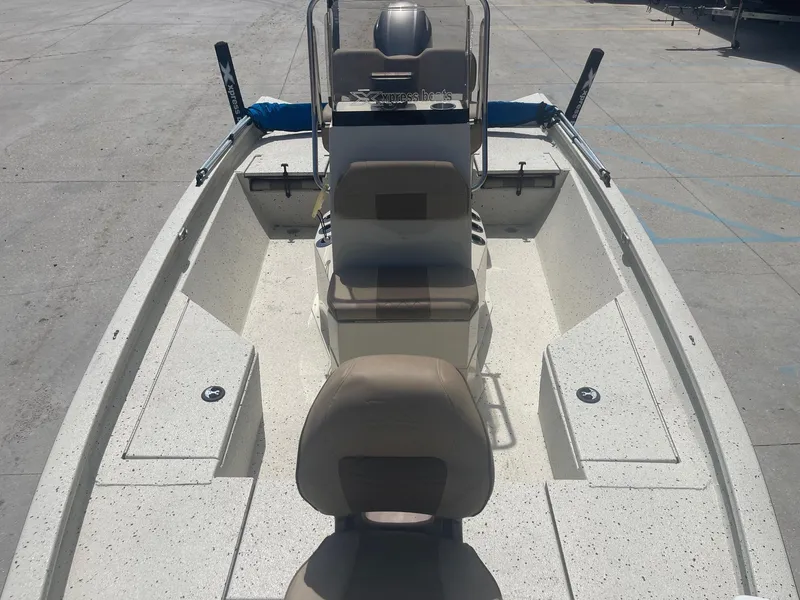 Slide: The Image of 2018 Express H20 Bay boat with seating and console, docked on concrete. - 10