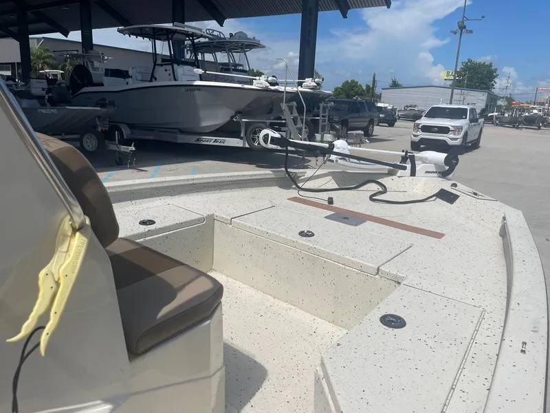 Slide: The Image of 2018 Express H20 Bay boat on display at a dealership. - 13