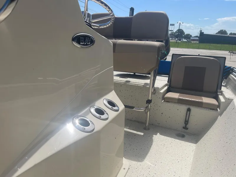 Slide: The Image of 2018 Express H20 Bay boat interior with seating and steering console. - 15