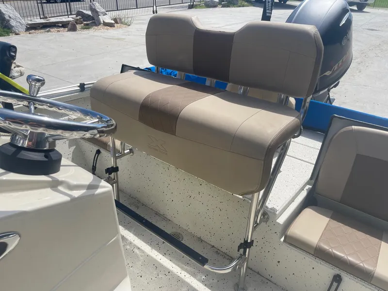 Slide: The Image of 2018 Express H20 Bay boat interior with seating and steering wheel. - 17