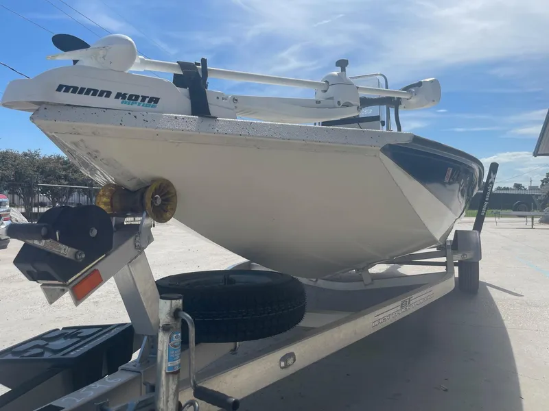 Slide: The Image of 2018 Express H20 Bay boat on trailer with Minn Kota trolling motor. - 19