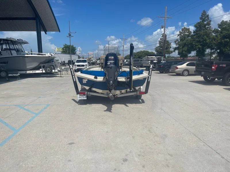Slide: The Image of 2018 Express H20 Bay boat on trailer in parking lot. - 6