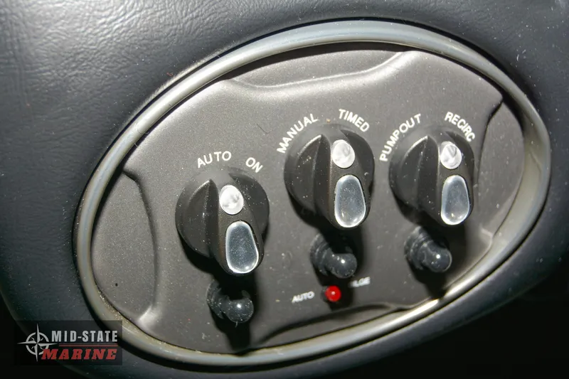 Slide: The Image of Control panel of 2024 Triton 18 TrX boat with various switches. - 10