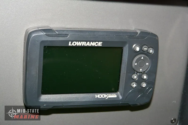 Slide: The Image of Lowrance Hook fish finder on 2024 Triton 18 TrX boat dashboard. - 11