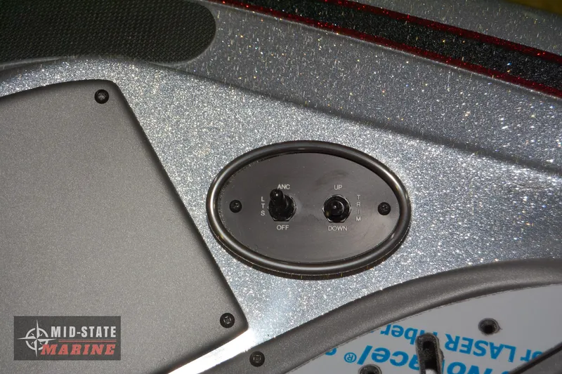 Slide: The Image of Control panel of 2024 Triton 18 TrX boat with Mid-State Marine logo. - 17