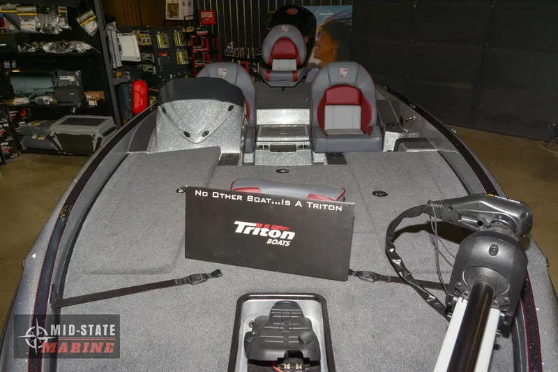 Slide: The Image of 2024 Triton 18 TrX boat interior at Mid-State Marine showroom. - 6