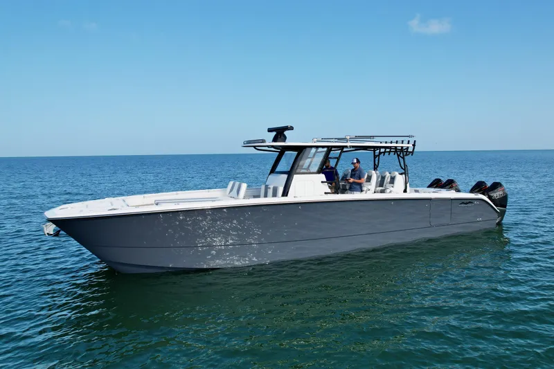 Slide: The Image of 2022 Invincible 40 Catamaran cruising on open water. - 1