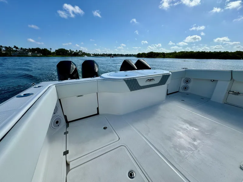 Slide: The Image of 2022 Invincible 40 Catamaran boat deck with outboard motors on a sunny day. - 13