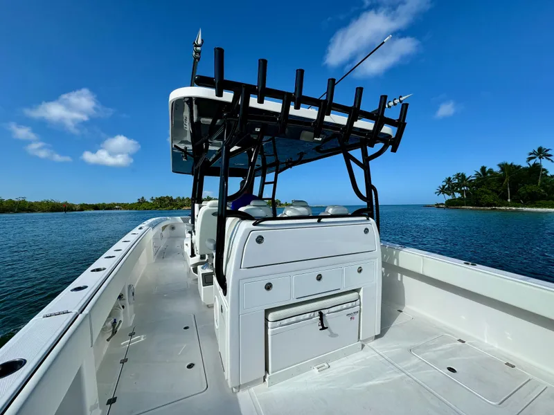 Slide: The Image of 2022 Invincible 40 Catamaran on calm waters with clear blue sky. - 15