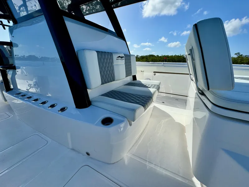 Slide: The Image of 2022 Invincible 40 Catamaran interior seating with blue sky background. - 20