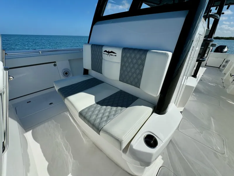 Slide: The Image of Invincible 40 Catamaran 2022 interior seating with ocean view. - 21