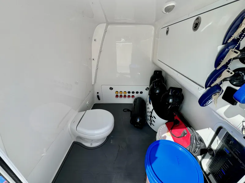 Slide: The Image of Interior of 2022 Invincible 40 Catamaran with toilet and storage space. - 26