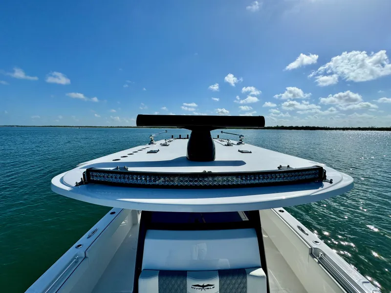 Slide: The Image of 2022 Invincible 40 Catamaran on calm waters under a clear blue sky. - 27