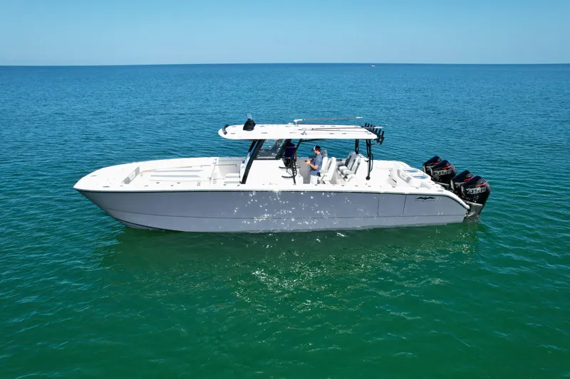 Slide: The Image of 2022 Invincible 40 Catamaran on calm ocean waters. - 29