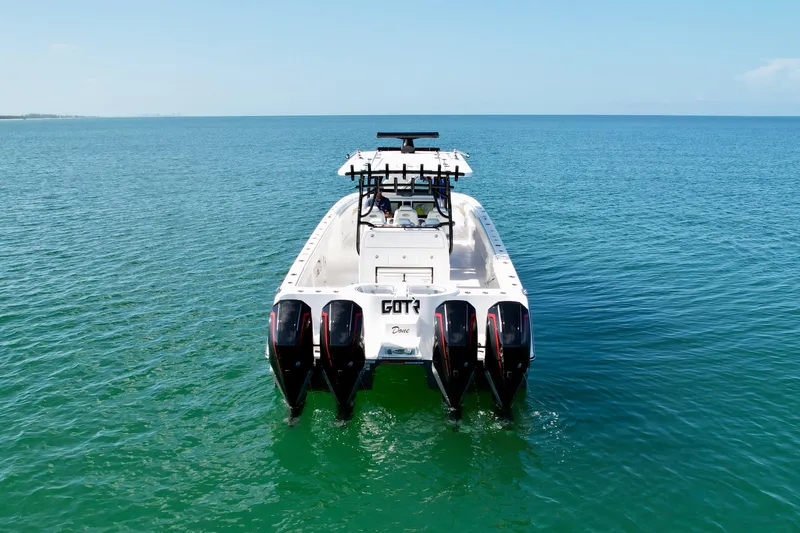 Slide: The Image of 2022 Invincible 40 Catamaran on open water, rear view. - 31