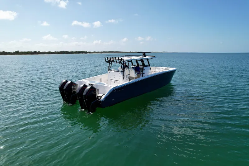 Slide: The Image of 2022 Invincible 40 Catamaran on calm waters. - 32