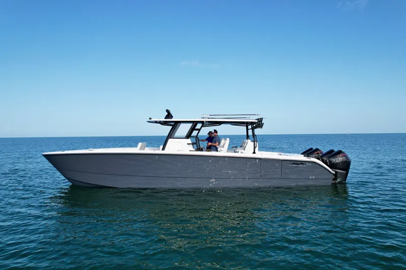 Slide: The Image of 2022 Invincible 40 Catamaran on calm ocean waters. - 35