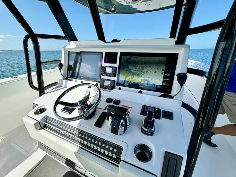 Slide: The Image of 2022 Invincible 40 Catamaran helm with advanced navigation and control systems. - 4