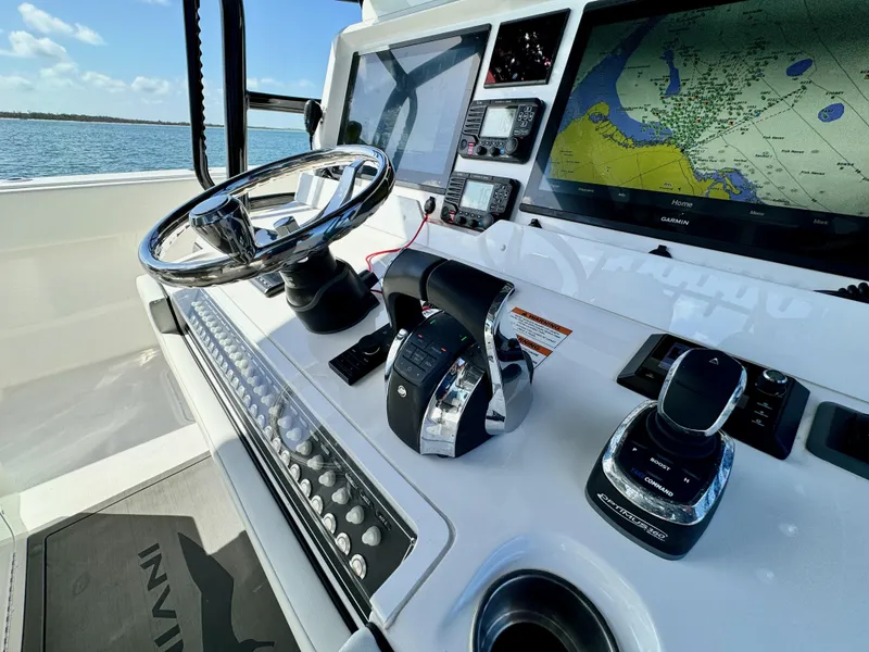 Slide: The Image of Invincible 40 Catamaran 2022 helm with navigation system and controls. - 5