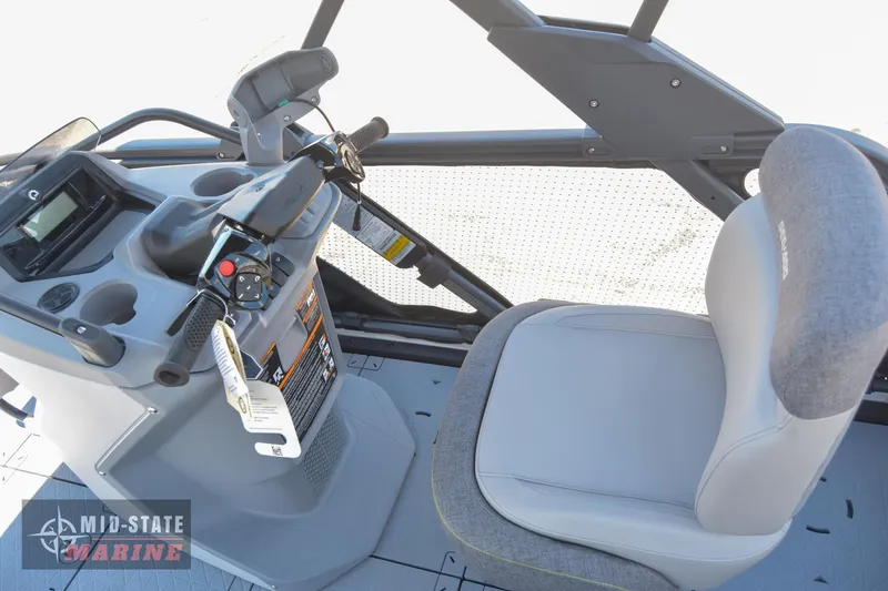 Slide: The Image of 2023 Sea-Doo Switch Sport 21 helm station with steering controls and comfortable seating. - 13