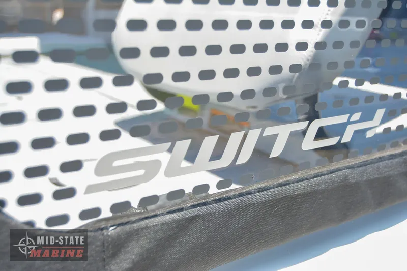 Slide: The Image of 2023 Sea-Doo Switch Sport 21 logo on perforated surface, Mid-State Marine branding. - 6