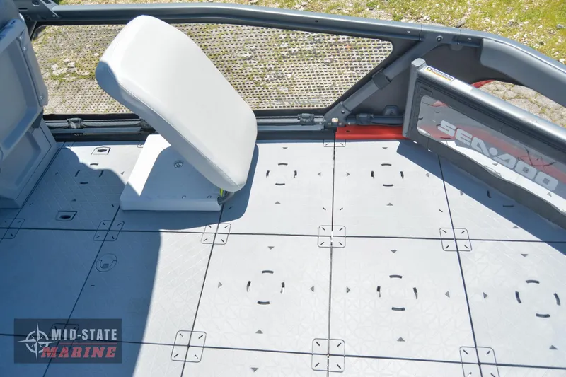Slide: The Image of 2023 Sea-Doo Switch Sport 21 deck with modular seating and non-slip flooring. - 8
