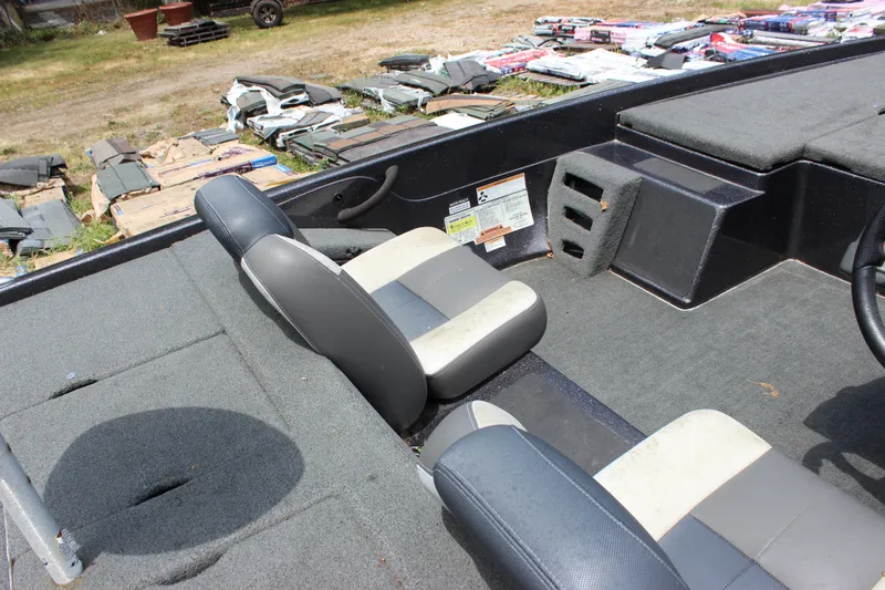 Slide: The Image of 2018 Skeeter ZX 190 boat interior with dual seats and carpeted flooring. - 16